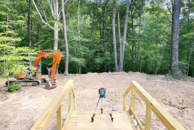 clearing and grading land for elegant flagstone patio installation 