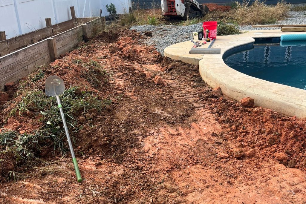 Artificial Grass for Charlotte Homes & Businesses 5 clearing sod for installation of artificial turf