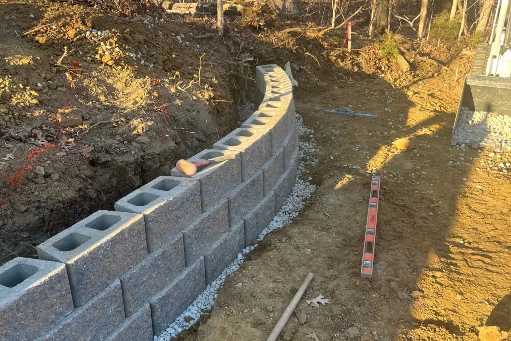 Retaining wall blocks with cut angles, creating a curved wall